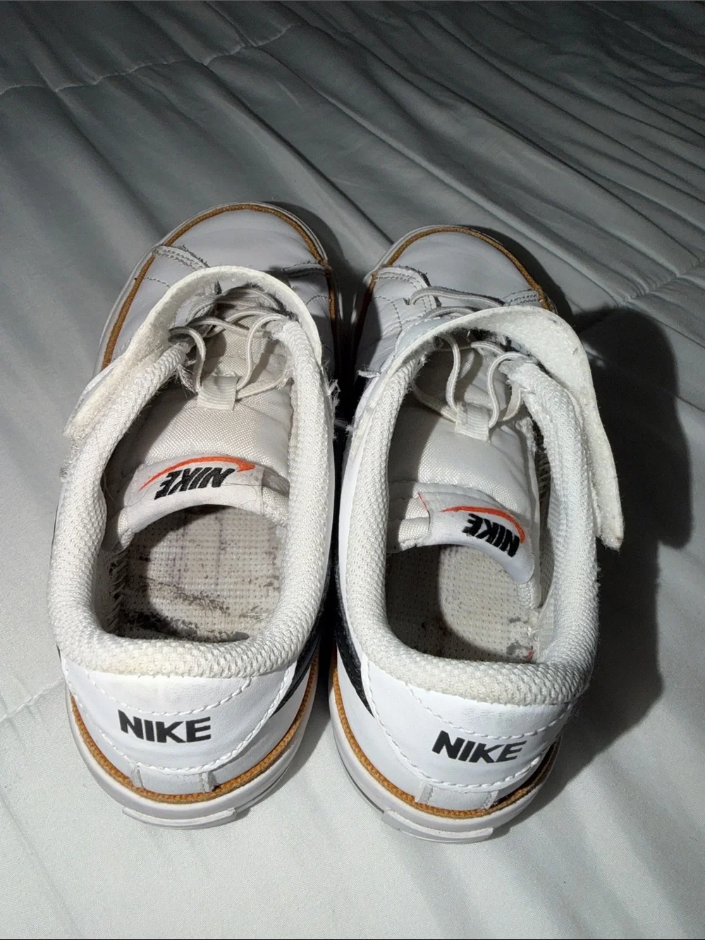 Nike White Kids Sneakers with Black Swoosh and Brown Trim